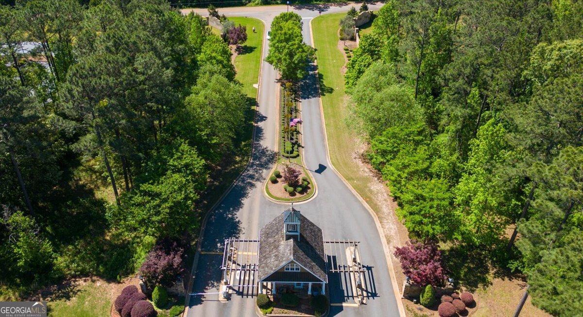106 Equestrian Drive Forsyth, GA 31029 - Photo 44 of 52 an aerial view of a house with garden space and trees all around