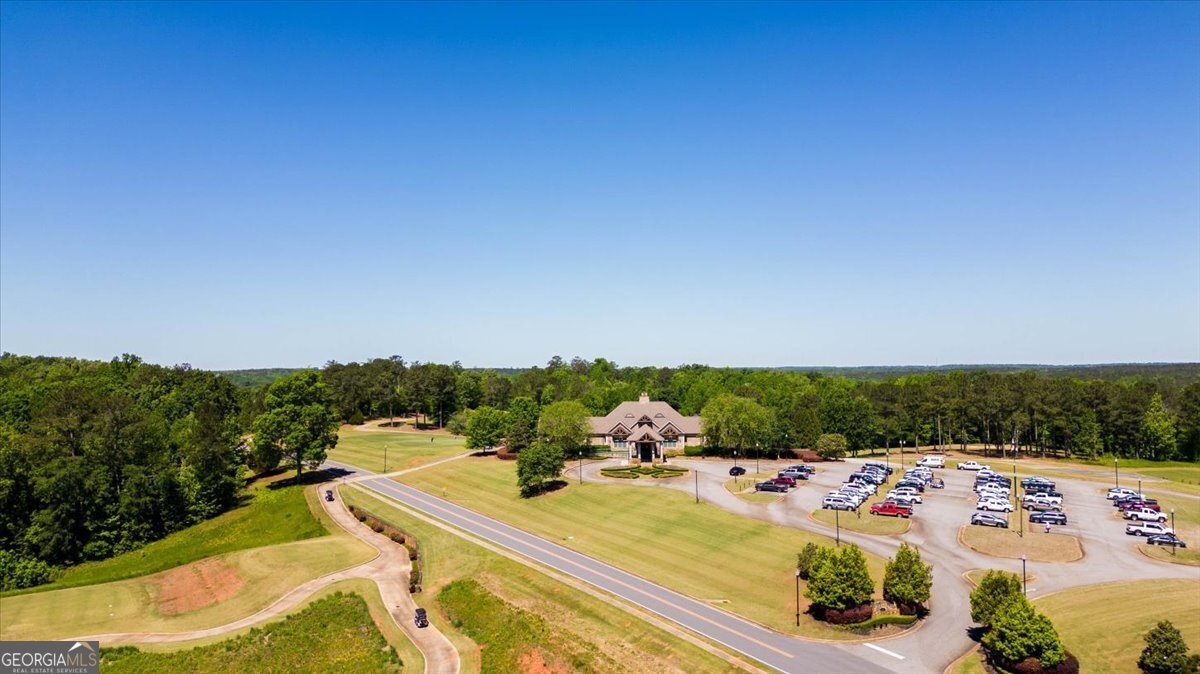 106 Equestrian Drive Forsyth, GA 31029 - Photo 46 of 52 a view of a swimming pool with a yard