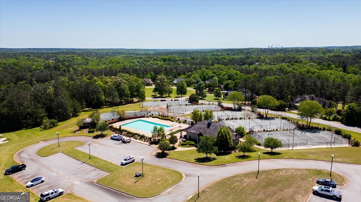 106 Equestrian Drive Forsyth, GA 31029 - Photo 47 of 52 a view of a swimming pool with lounge chairs