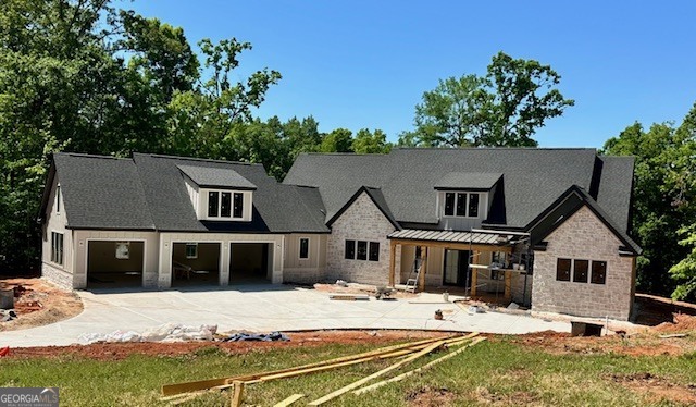 106 Equestrian Drive Forsyth, GA 31029 - Photo 52 of 52 a front view of a house with a yard