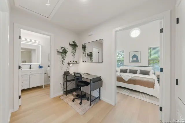 a view of a livingroom with a couch and a dresser