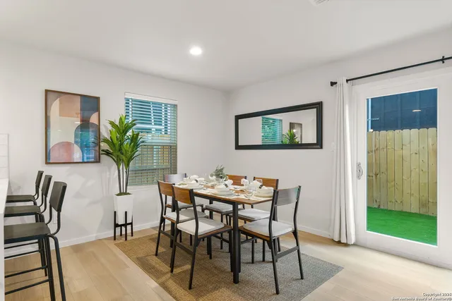a dining room with furniture and window