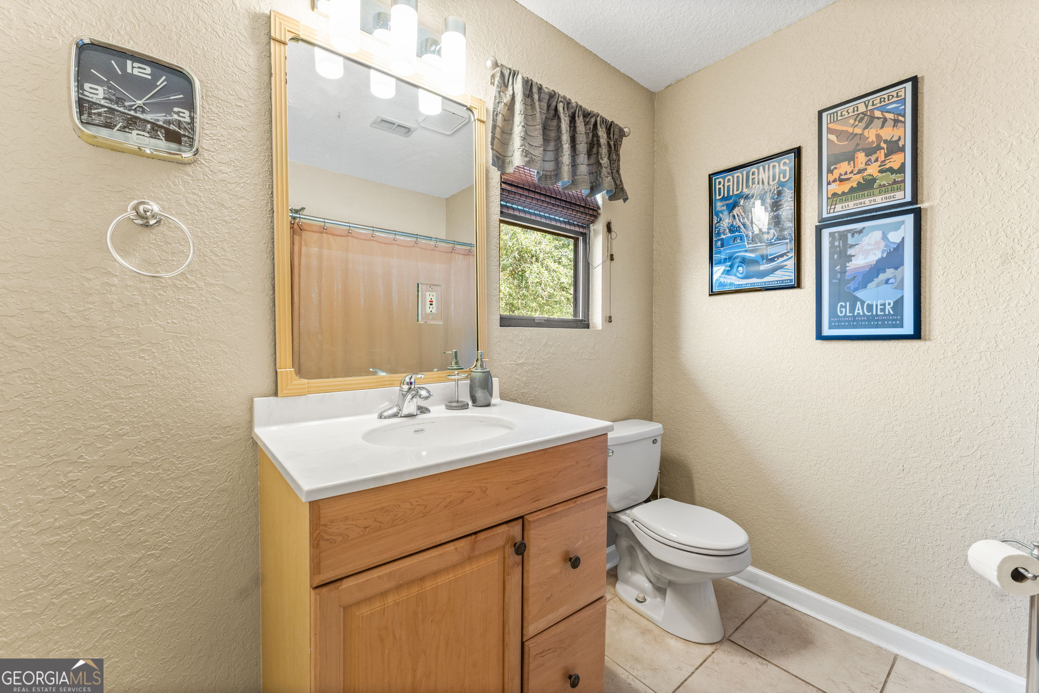 323 St Marys River Bluff Road St. George, GA 31562 - Photo 17 of 43 a bathroom with a toilet a sink and mirror