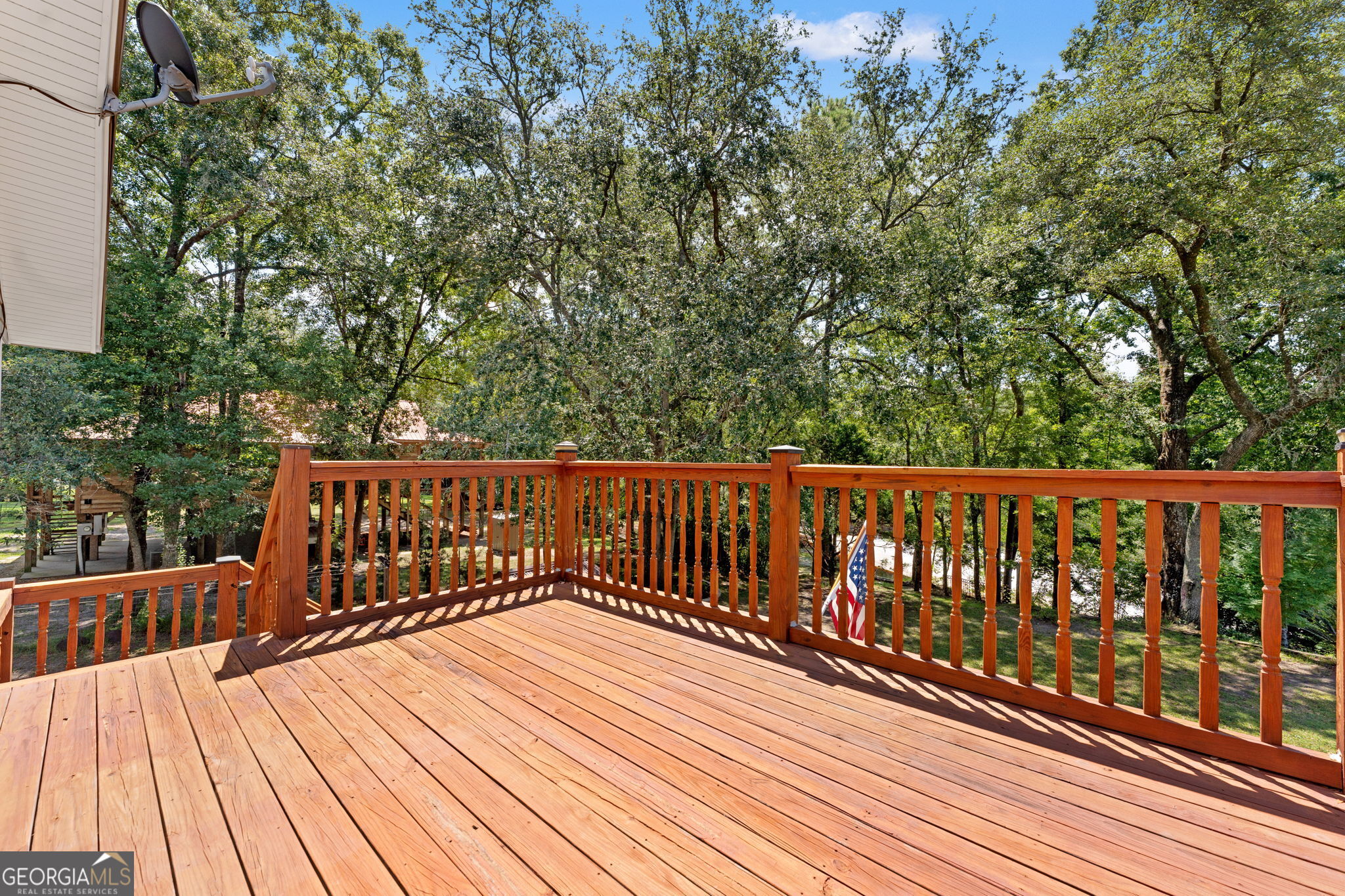 323 St Marys River Bluff Road St. George, GA 31562 - Photo 20 of 43 a balcony with wooden floor and fence