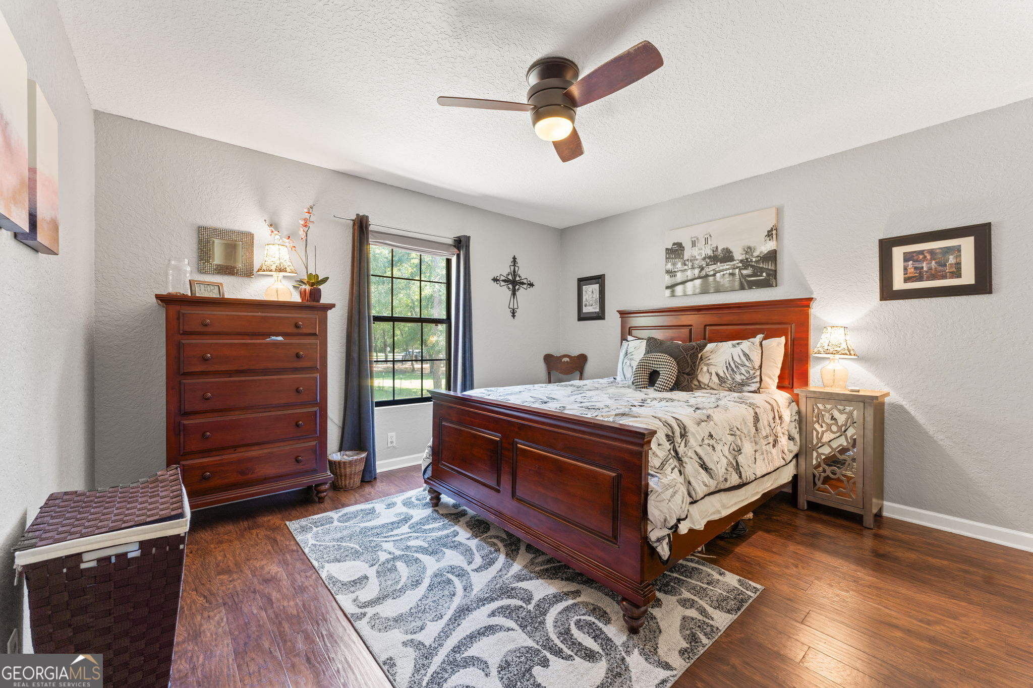 323 St Marys River Bluff Road St. George, GA 31562 - Photo 23 of 43 a bedroom with a bed and a dresser