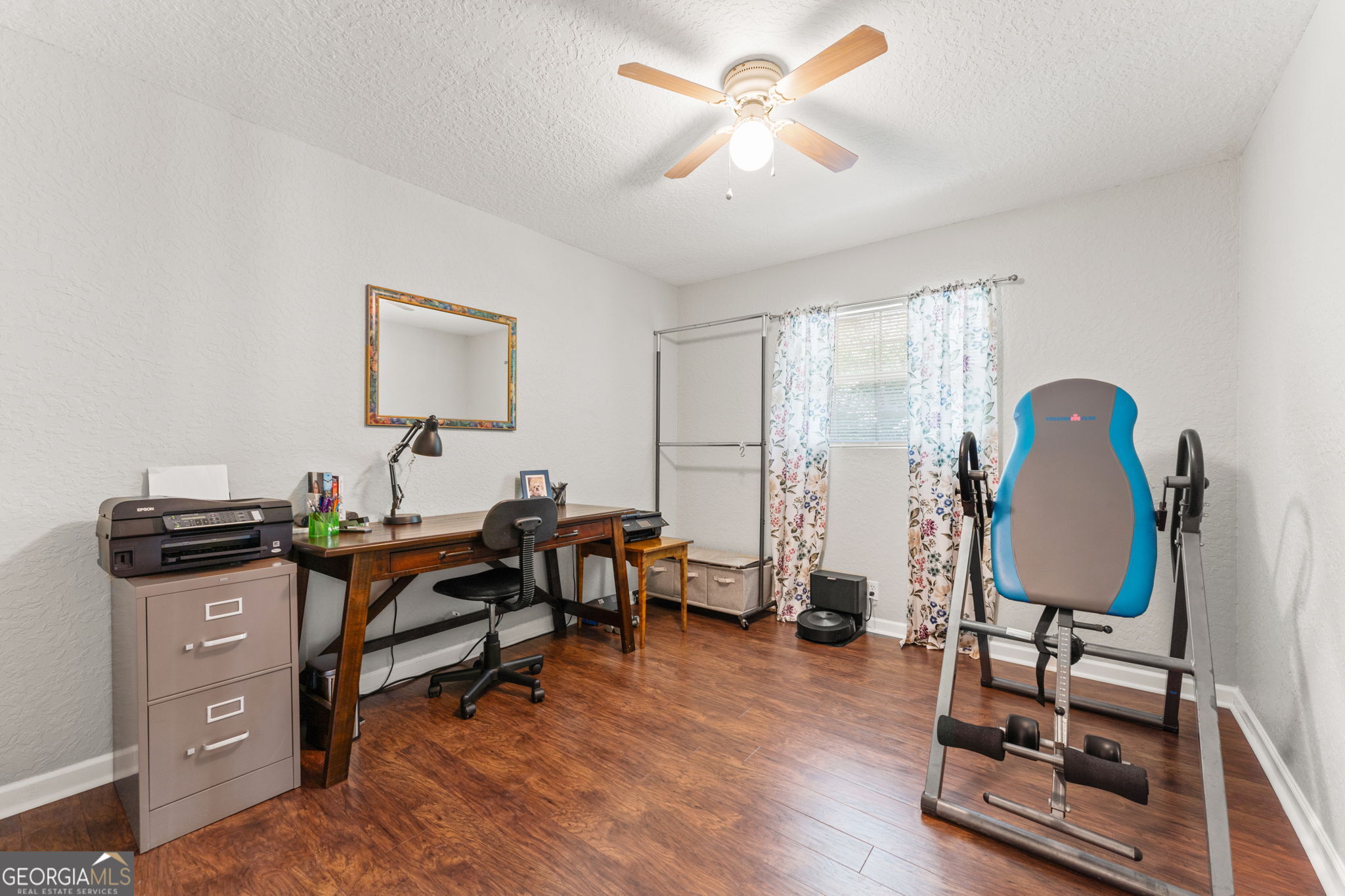 323 St Marys River Bluff Road St. George, GA 31562 - Photo 26 of 43 a view of a workspace with furniture and a window
