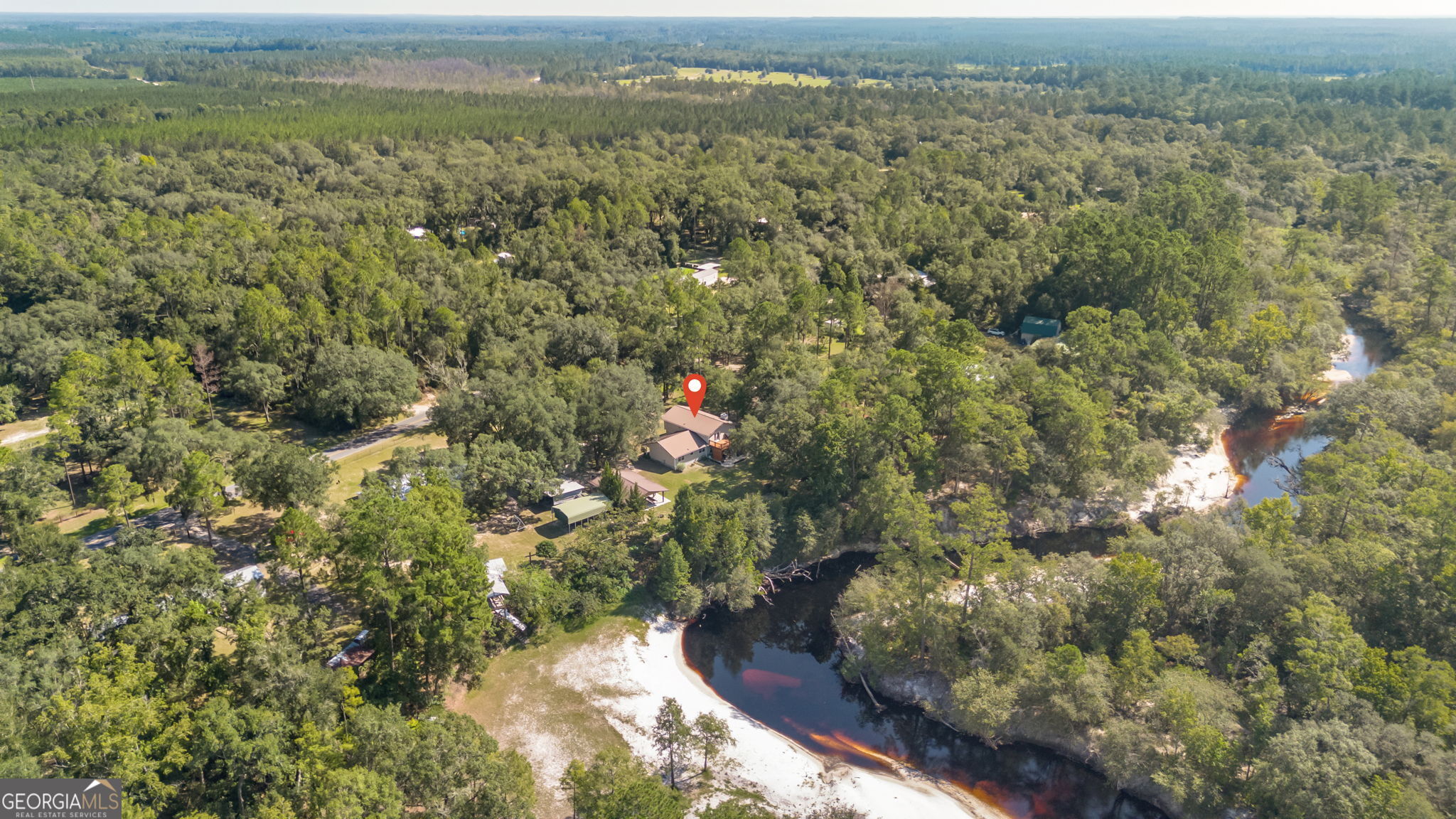 323 St Marys River Bluff Road St. George, GA 31562 - Photo 40 of 43 a view of a city with lush green forest