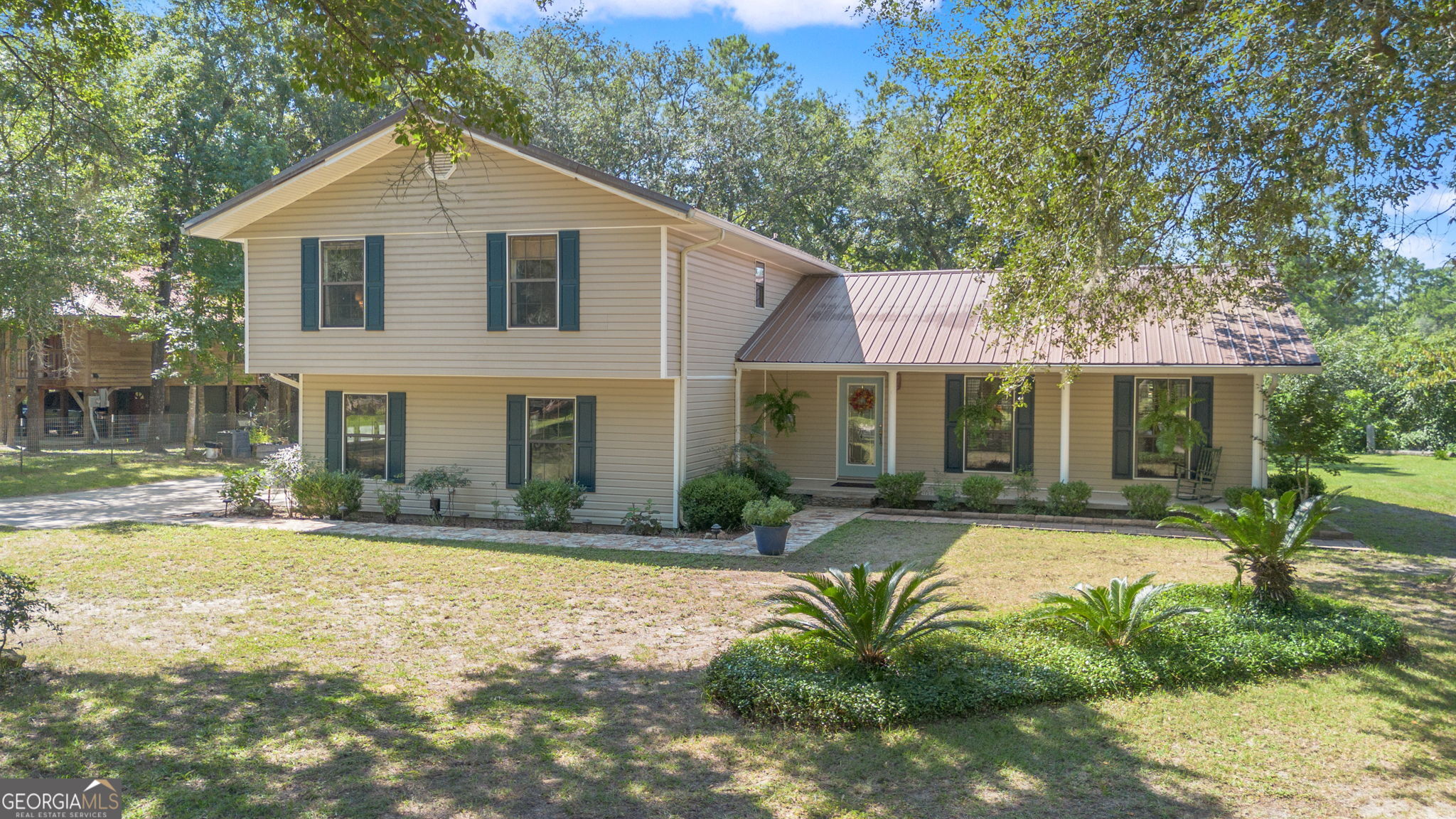 323 St Marys River Bluff Road St. George, GA 31562 - Photo 4 of 43 a front view of a house with a yard