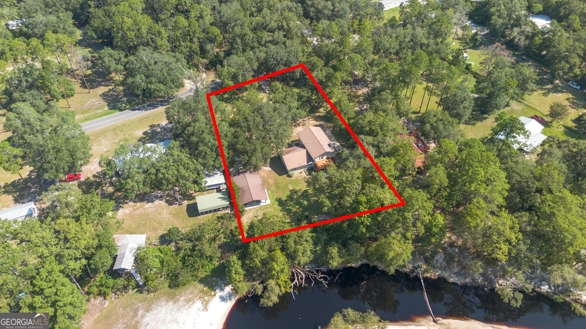 323 St Marys River Bluff Road St. George, GA 31562 - Photo 42 of 43 an aerial view of a houses
