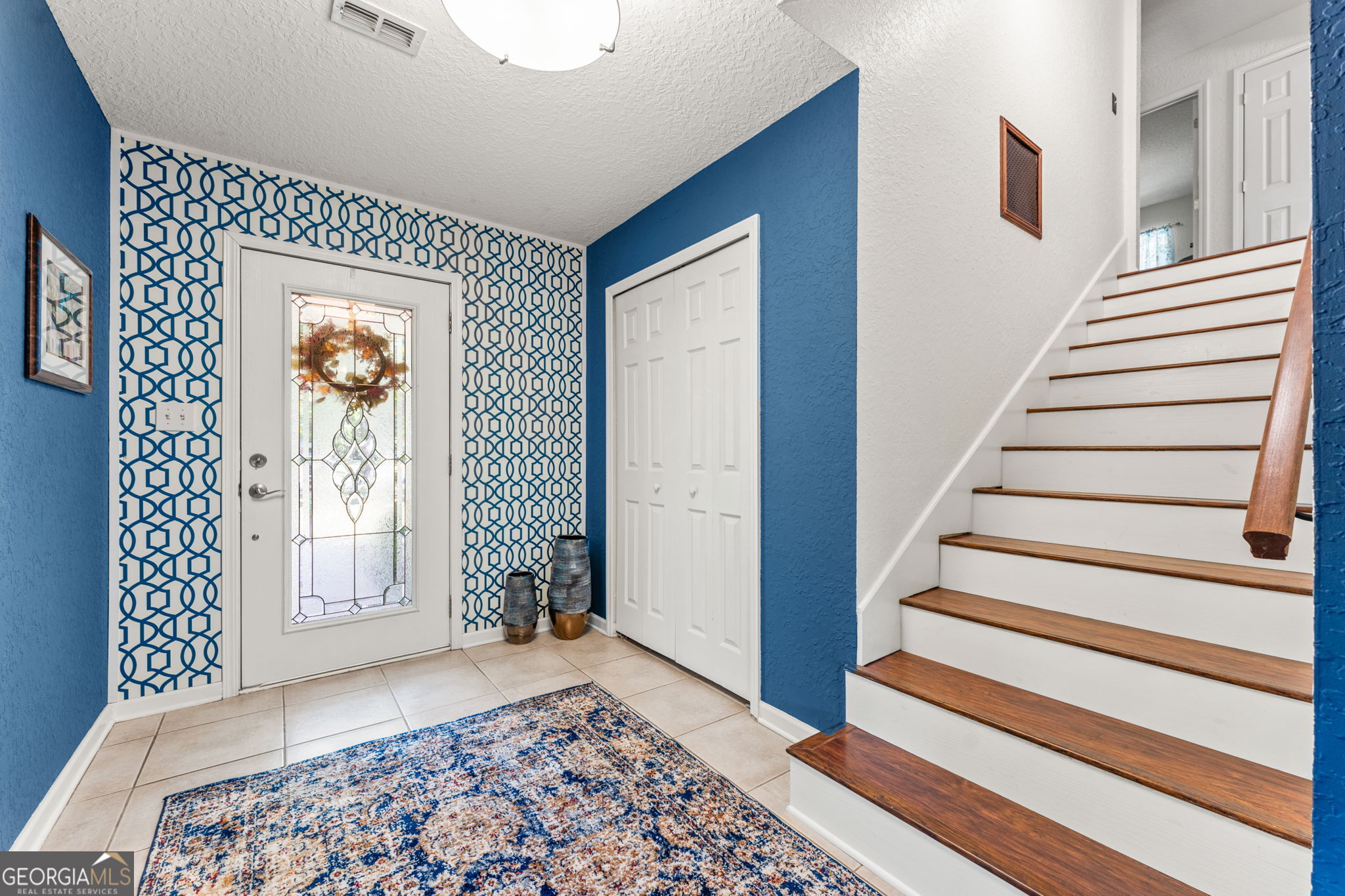 323 St Marys River Bluff Road St. George, GA 31562 - Photo 7 of 43 a view of a hallway with windows and stairs