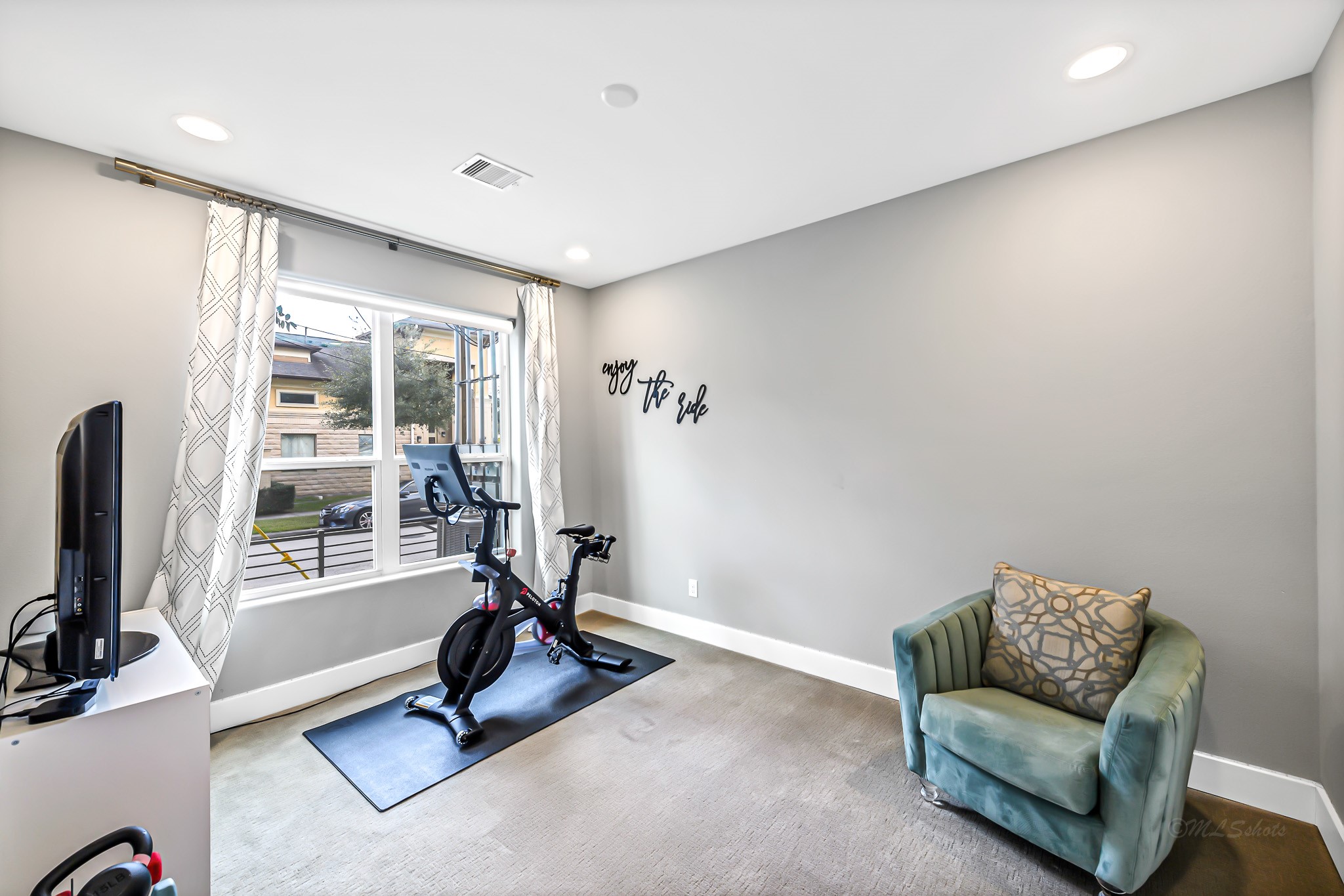 3105 Gillespie Street Houston, TX 77020 - Photo 6 of 43 a view of a room with gym equipment and a large window