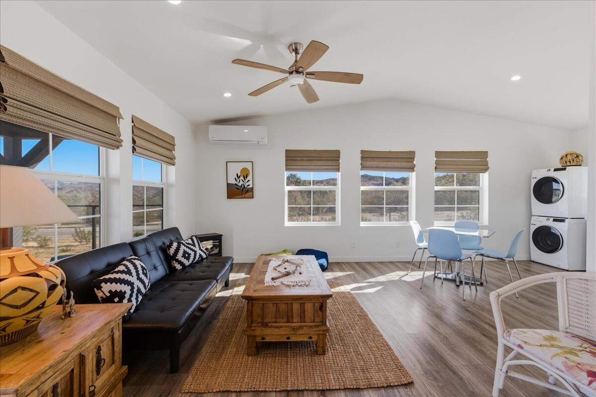4884 Avenida Del Sol Joshua Tree, CA 92252 - Photo 11 of 66 a living room with furniture two window and a table