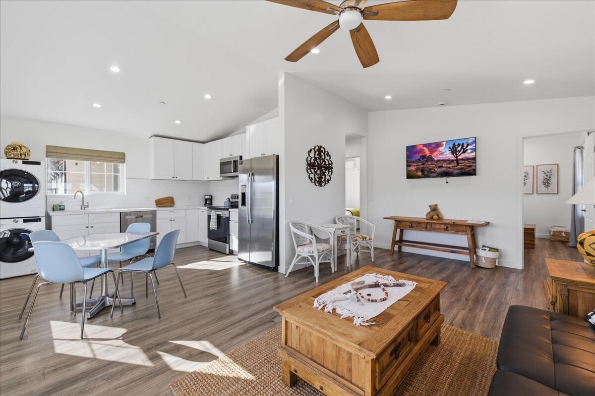 4884 Avenida Del Sol Joshua Tree, CA 92252 - Photo 15 of 66 a living room with furniture and a flat screen tv