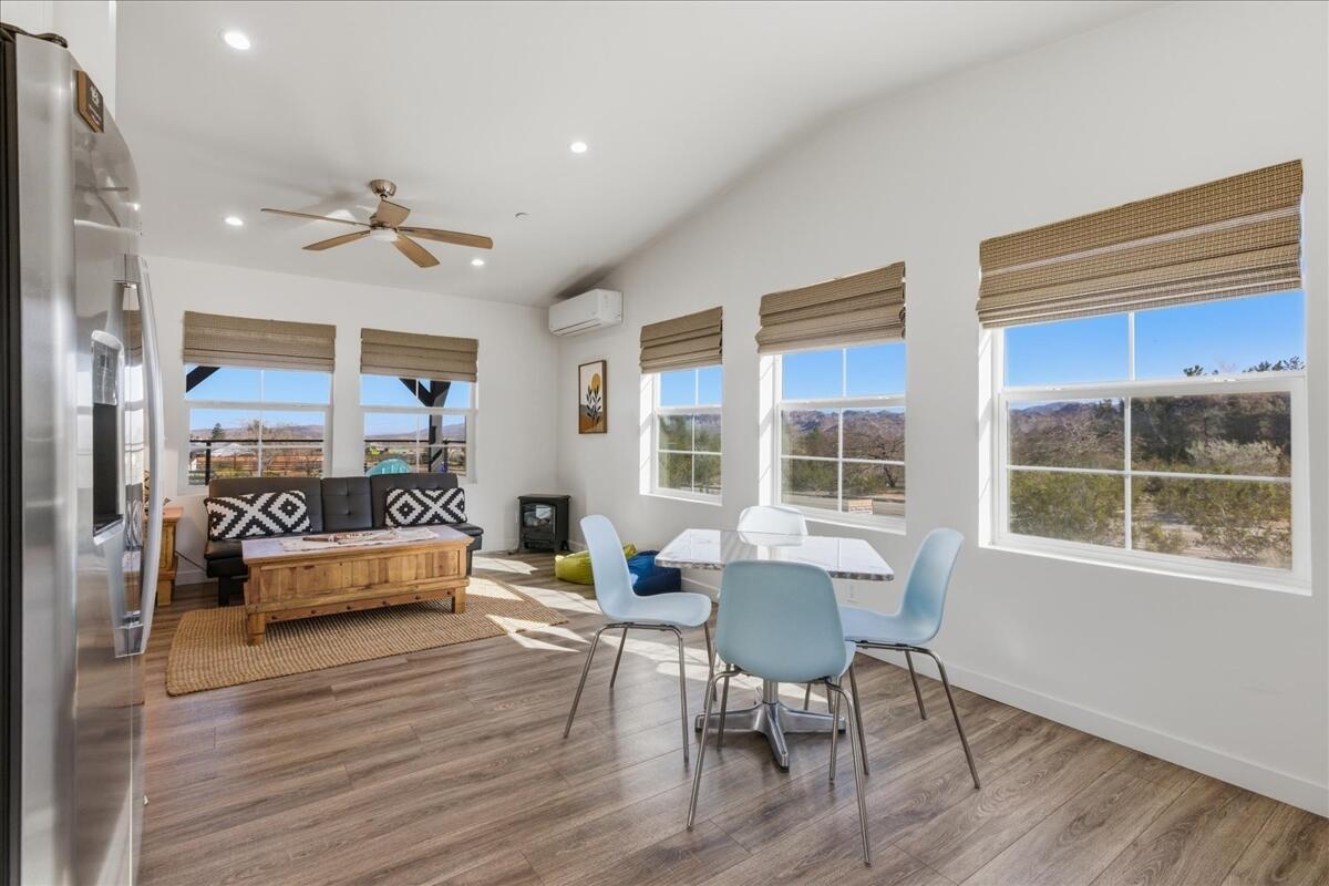 4884 Avenida Del Sol Joshua Tree, CA 92252 - Photo 16 of 66 a living room with furniture and a large window