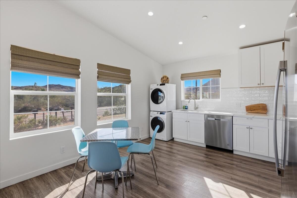 4884 Avenida Del Sol Joshua Tree, CA 92252 - Photo 18 of 66 a view of a dining room with furniture and windows