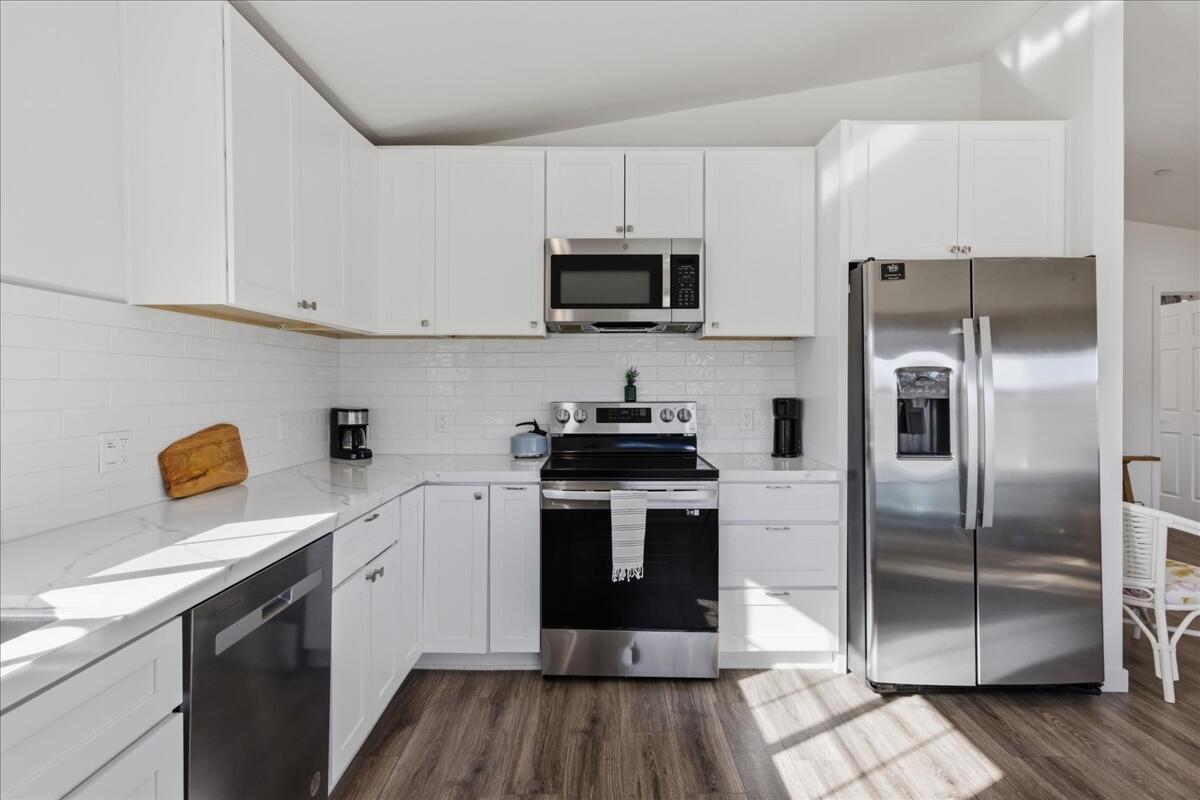 4884 Avenida Del Sol Joshua Tree, CA 92252 - Photo 21 of 66 a kitchen with a sink stainless steel appliances and cabinets