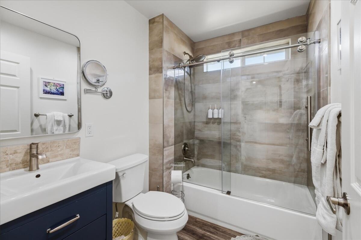 4884 Avenida Del Sol Joshua Tree, CA 92252 - Photo 25 of 66 a bathroom with a bathtub shower sink vanity and toilet