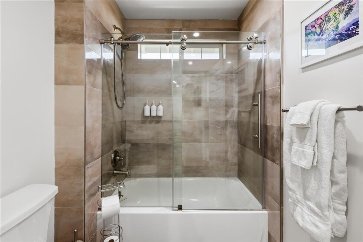 4884 Avenida Del Sol Joshua Tree, CA 92252 - Photo 27 of 66 a bathroom with a bathtub and a shower