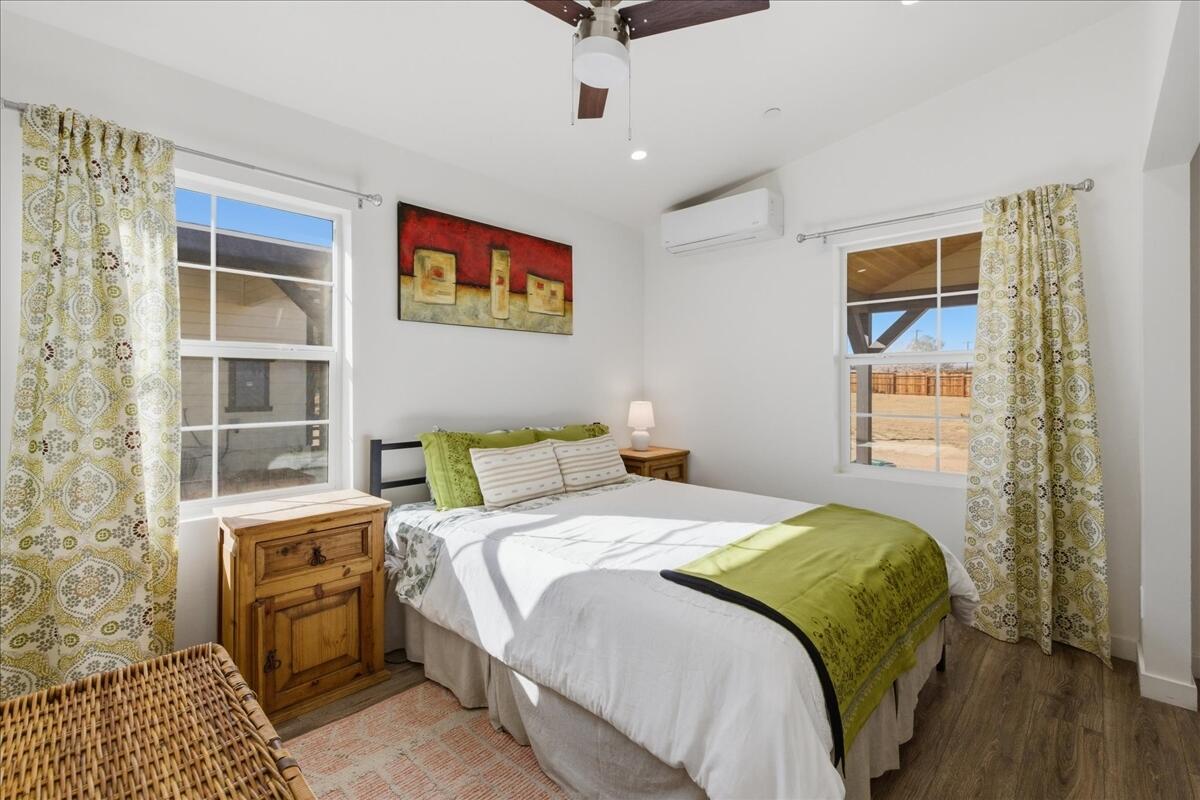 4884 Avenida Del Sol Joshua Tree, CA 92252 - Photo 28 of 66 a bedroom with a bed and a window