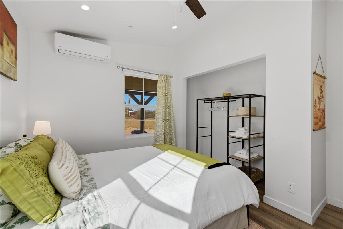 4884 Avenida Del Sol Joshua Tree, CA 92252 - Photo 29 of 66 a bedroom with a bed and a window