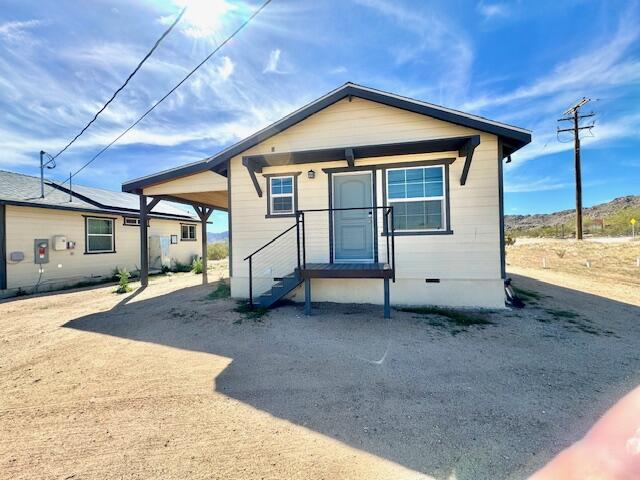 4884 Avenida Del Sol Joshua Tree, CA 92252 - Photo 31 of 66 a view of a house with a yard