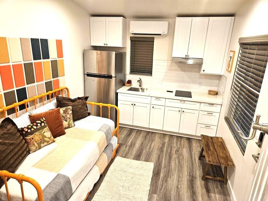 4884 Avenida Del Sol Joshua Tree, CA 92252 - Photo 33 of 66 a living room with a couch and a flat screen tv