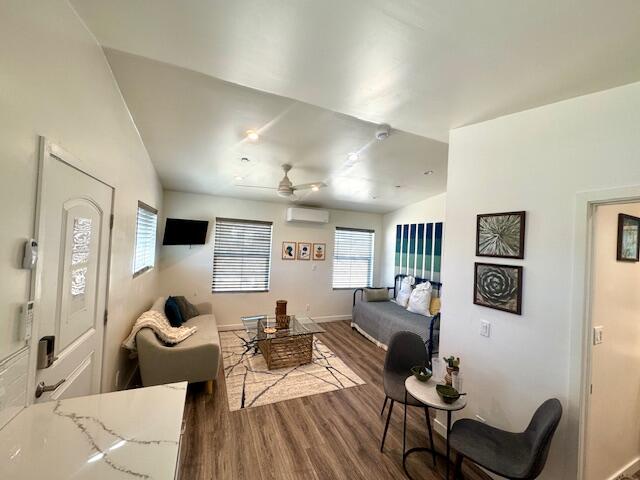 4884 Avenida Del Sol Joshua Tree, CA 92252 - Photo 40 of 66 a living room with furniture and wooden floor