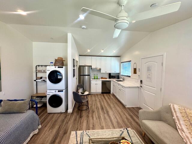 4884 Avenida Del Sol Joshua Tree, CA 92252 - Photo 42 of 66 a kitchen with a refrigerator and wooden floor