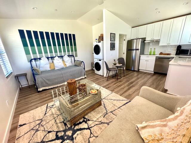 4884 Avenida Del Sol Joshua Tree, CA 92252 - Photo 45 of 66 a living room with furniture rug and wooden floor