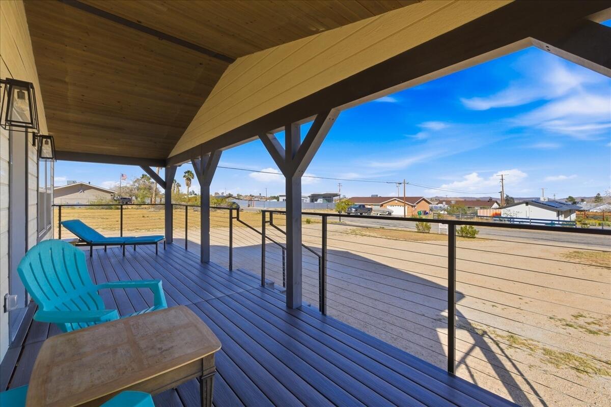 4884 Avenida Del Sol Joshua Tree, CA 92252 - Photo 56 of 66 a view of a balcony with chairs
