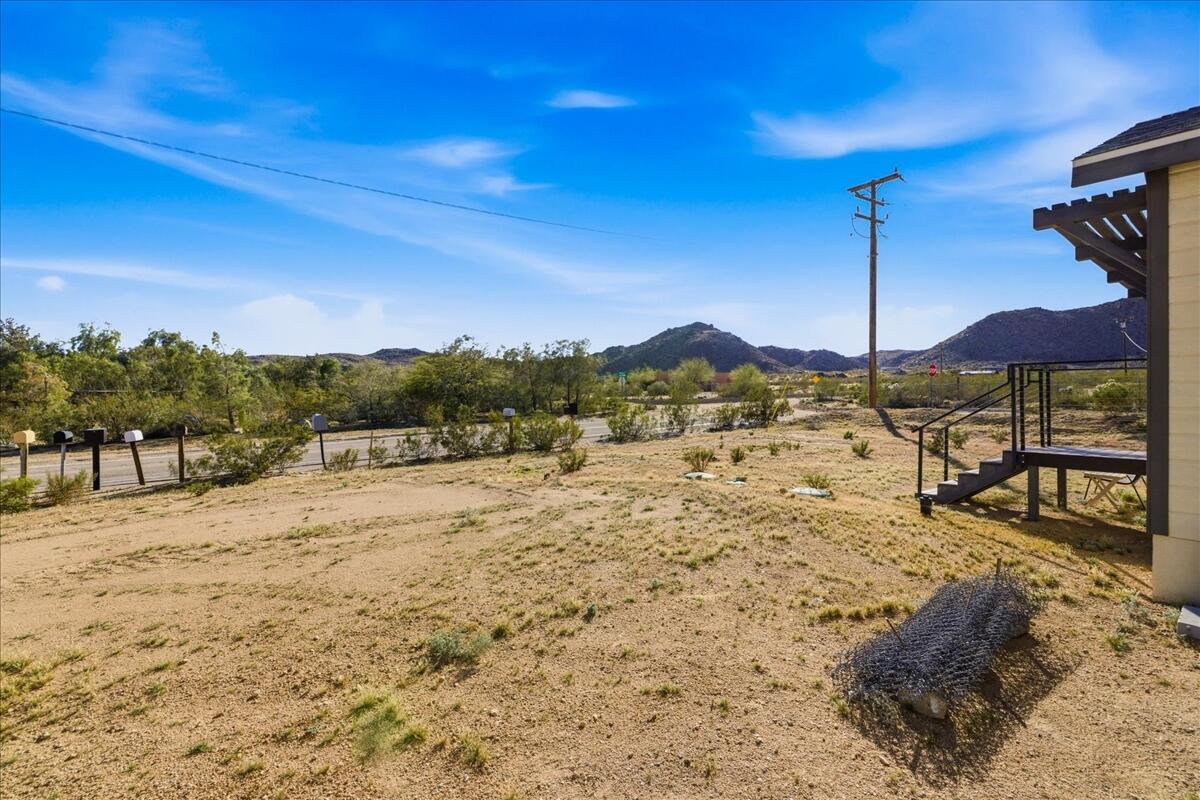 4884 Avenida Del Sol Joshua Tree, CA 92252 - Photo 57 of 66 a view of a road with a yard