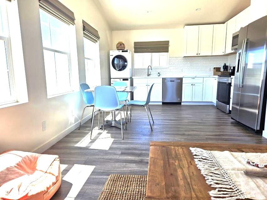4884 Avenida Del Sol Joshua Tree, CA 92252 - Photo 9 of 66 a kitchen with stainless steel appliances kitchen island granite countertop a sink and cabinets