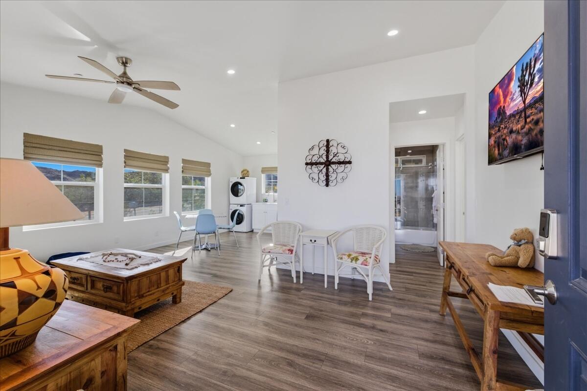 4884 Avenida Del Sol Joshua Tree, CA 92252 - Photo 10 of 66 a living room with furniture and wooden floor