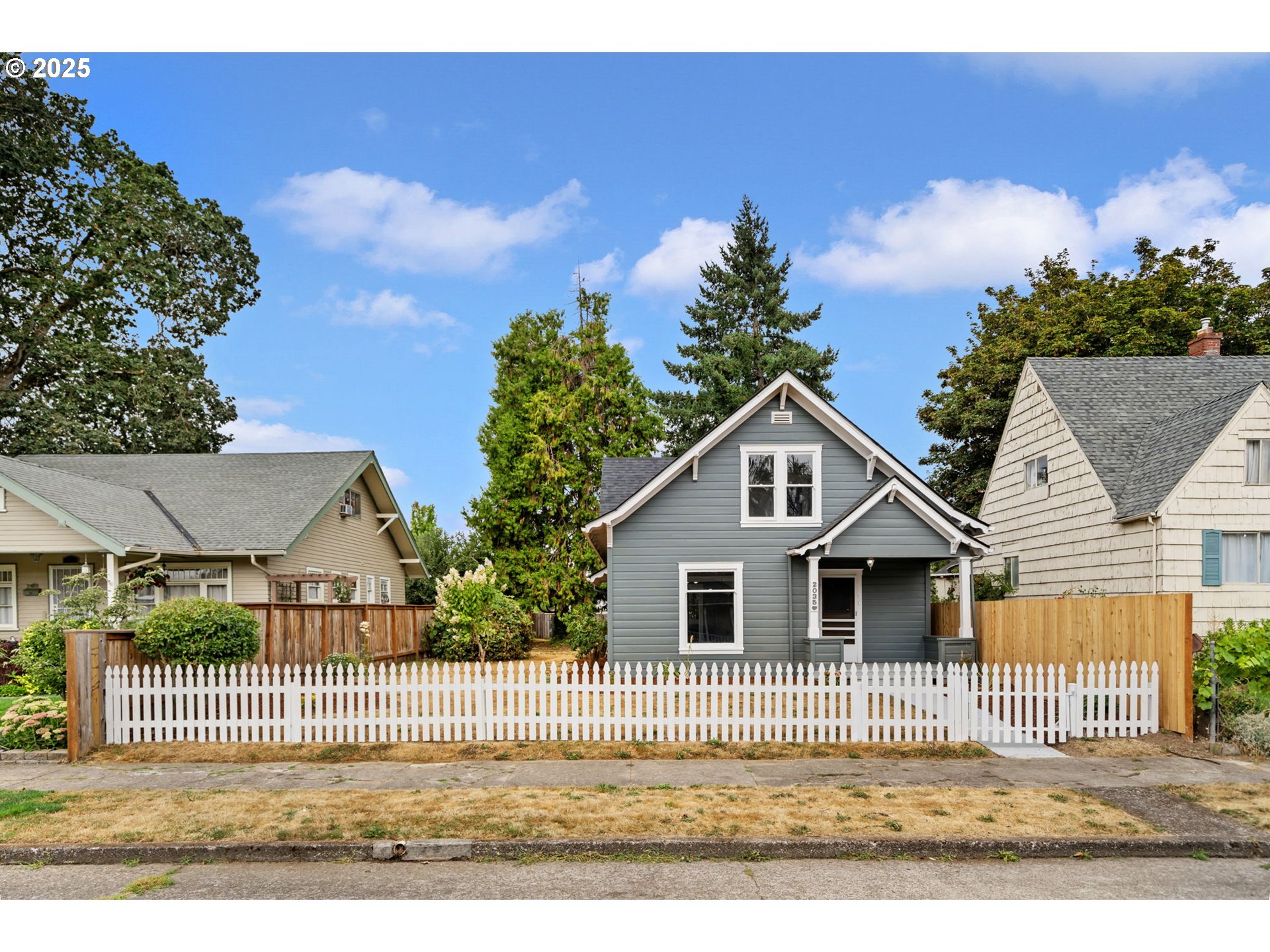 2035 4th Street Northeast Salem, OR 97301 - Photo 1 of 45 a front view of a house with a garden