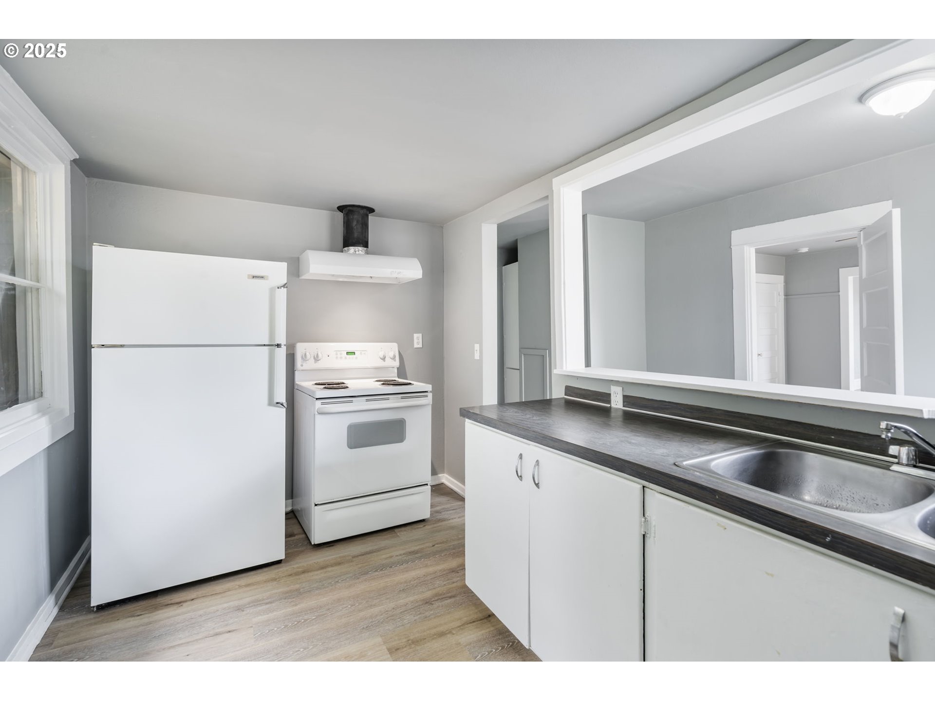 2035 4th Street Northeast Salem, OR 97301 - Photo 12 of 45 a kitchen with a sink cabinets and stainless steel appliances
