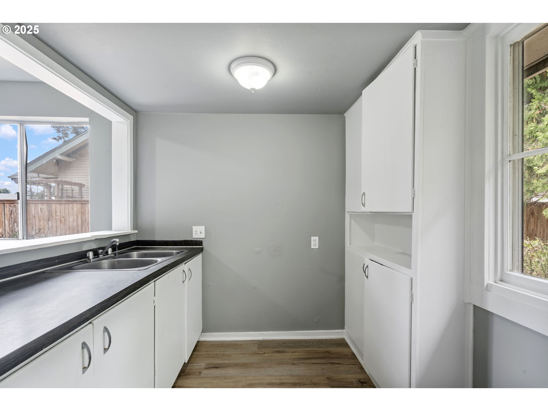 2035 4th Street Northeast Salem, OR 97301 - Photo 15 of 45 a kitchen with granite countertop a stove a sink and a microwave