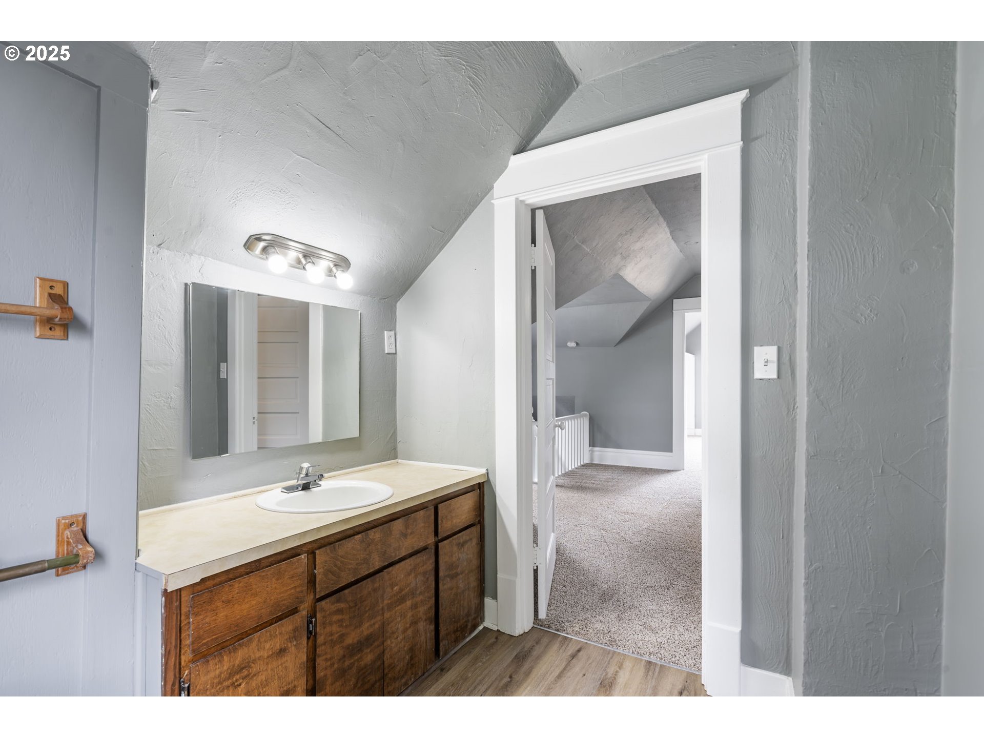 2035 4th Street Northeast Salem, OR 97301 - Photo 19 of 45 a bathroom with a sink vanity and mirror
