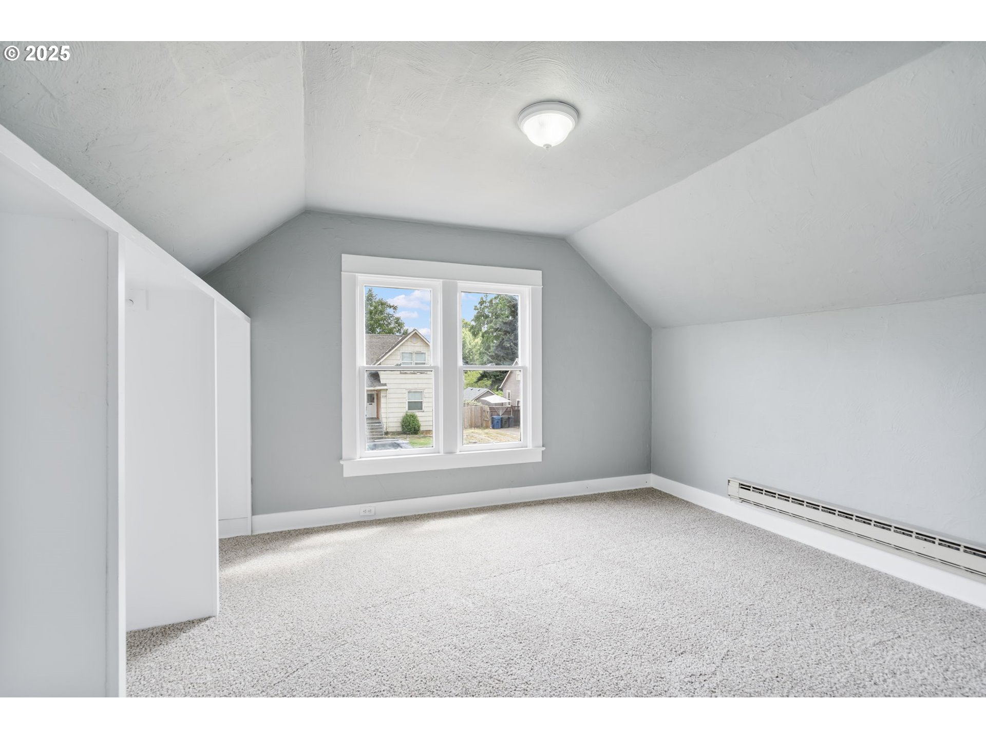 2035 4th Street Northeast Salem, OR 97301 - Photo 21 of 45 a view of an empty room with a window