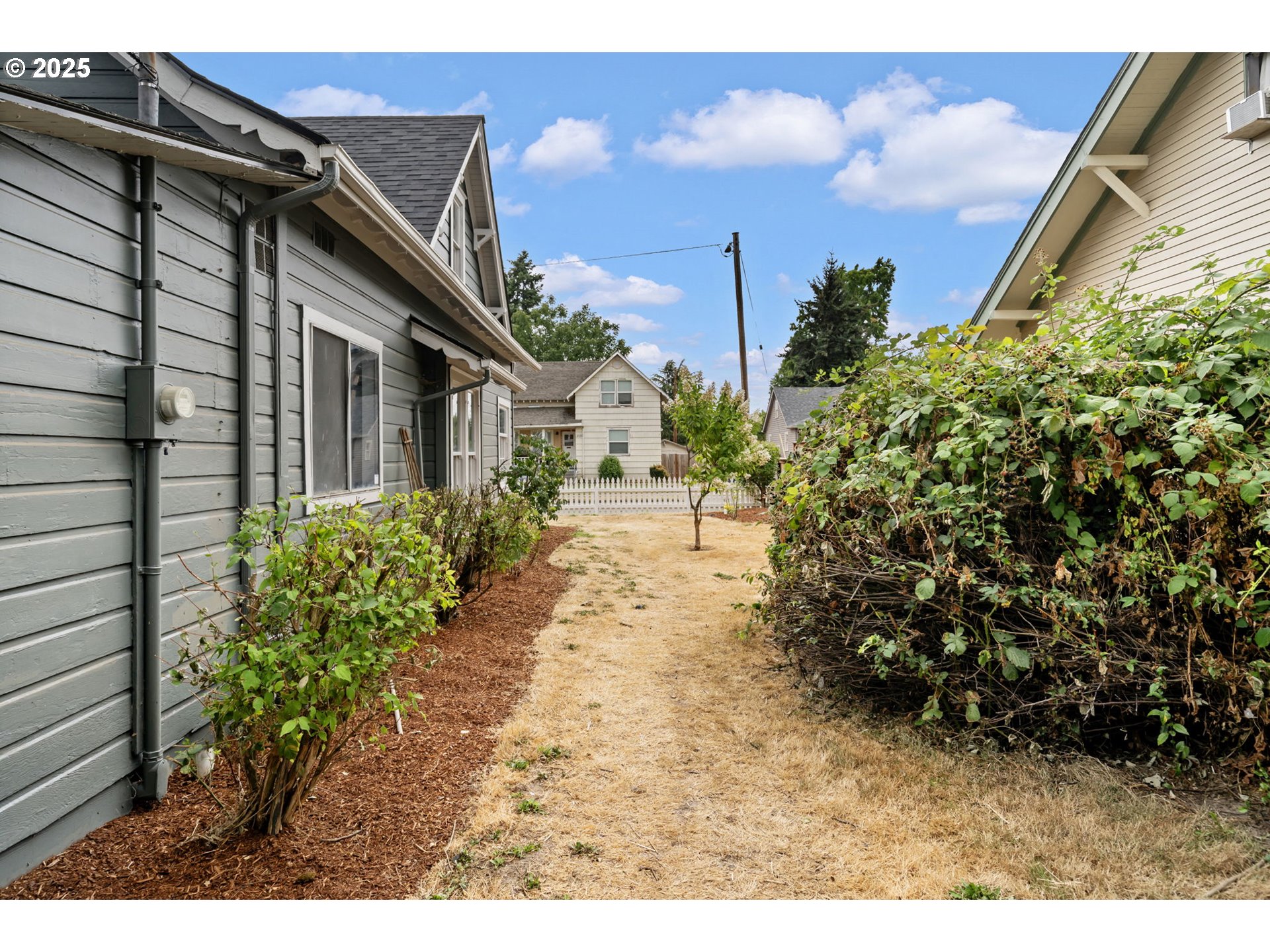 2035 4th Street Northeast Salem, OR 97301 - Photo 39 of 45 a backyard of a house with lots of green space