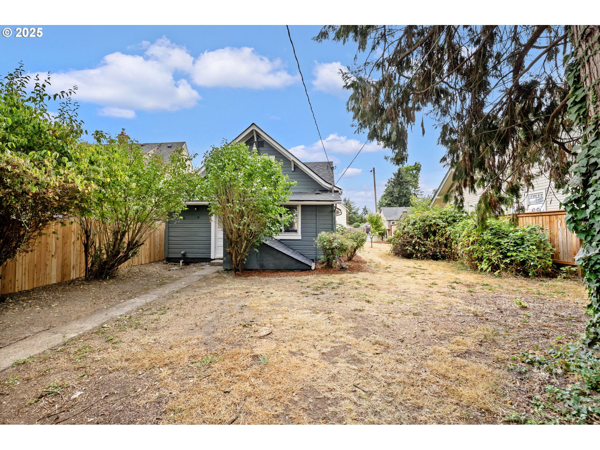 2035 4th Street Northeast Salem, OR 97301 - Photo 43 of 45 a backyard of a house with lots of green space