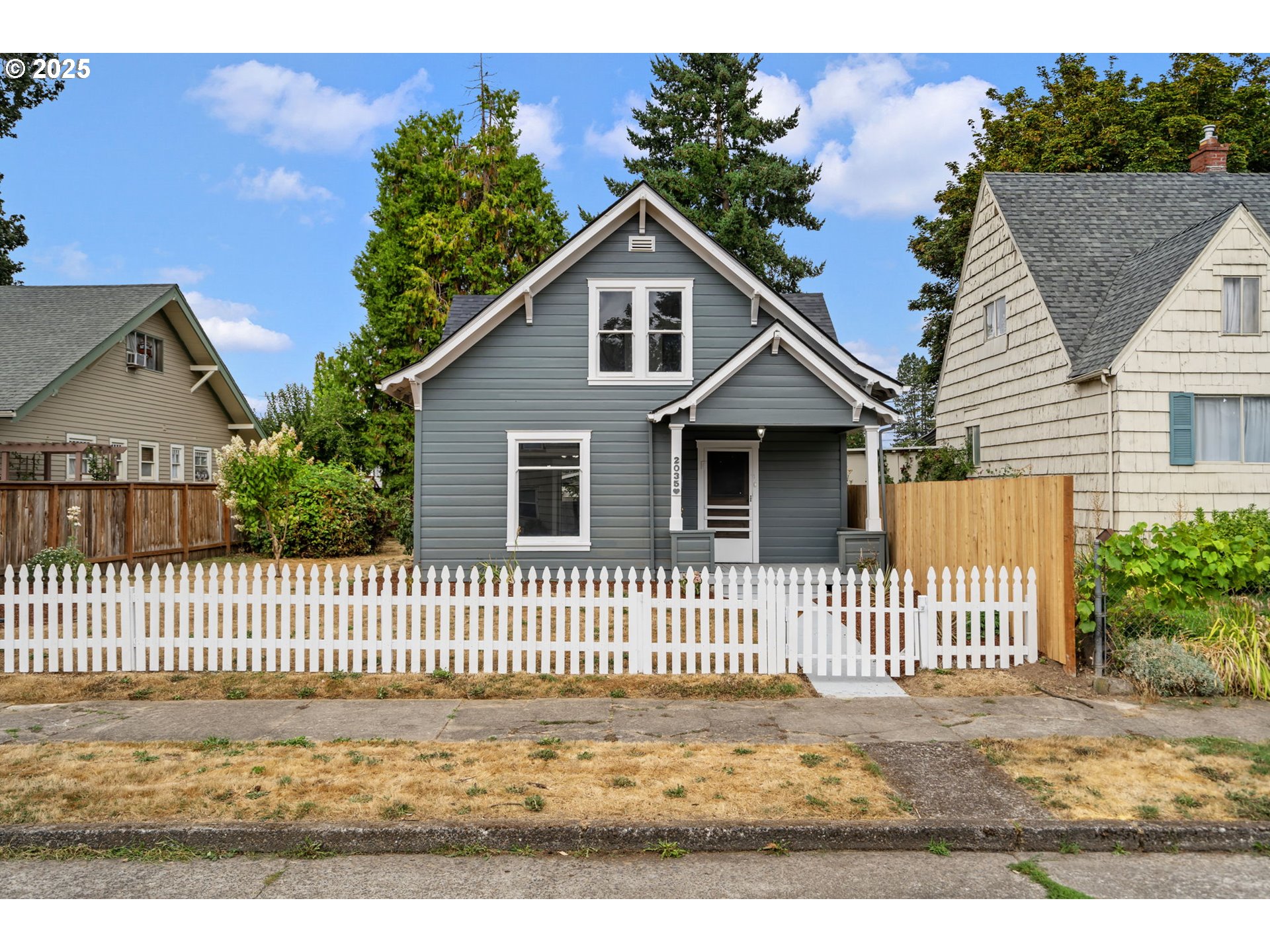 2035 4th Street Northeast Salem, OR 97301 - Photo 45 of 45 a view of a house with a small yard and wooden fence