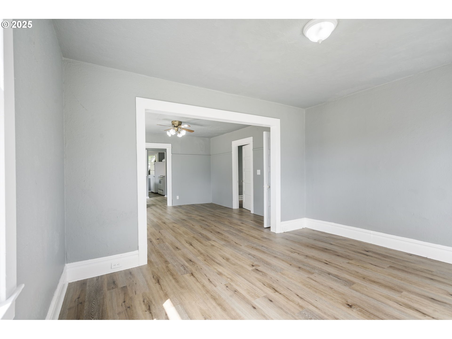 2035 4th Street Northeast Salem, OR 97301 - Photo 6 of 45 a view of an empty room and wooden floor