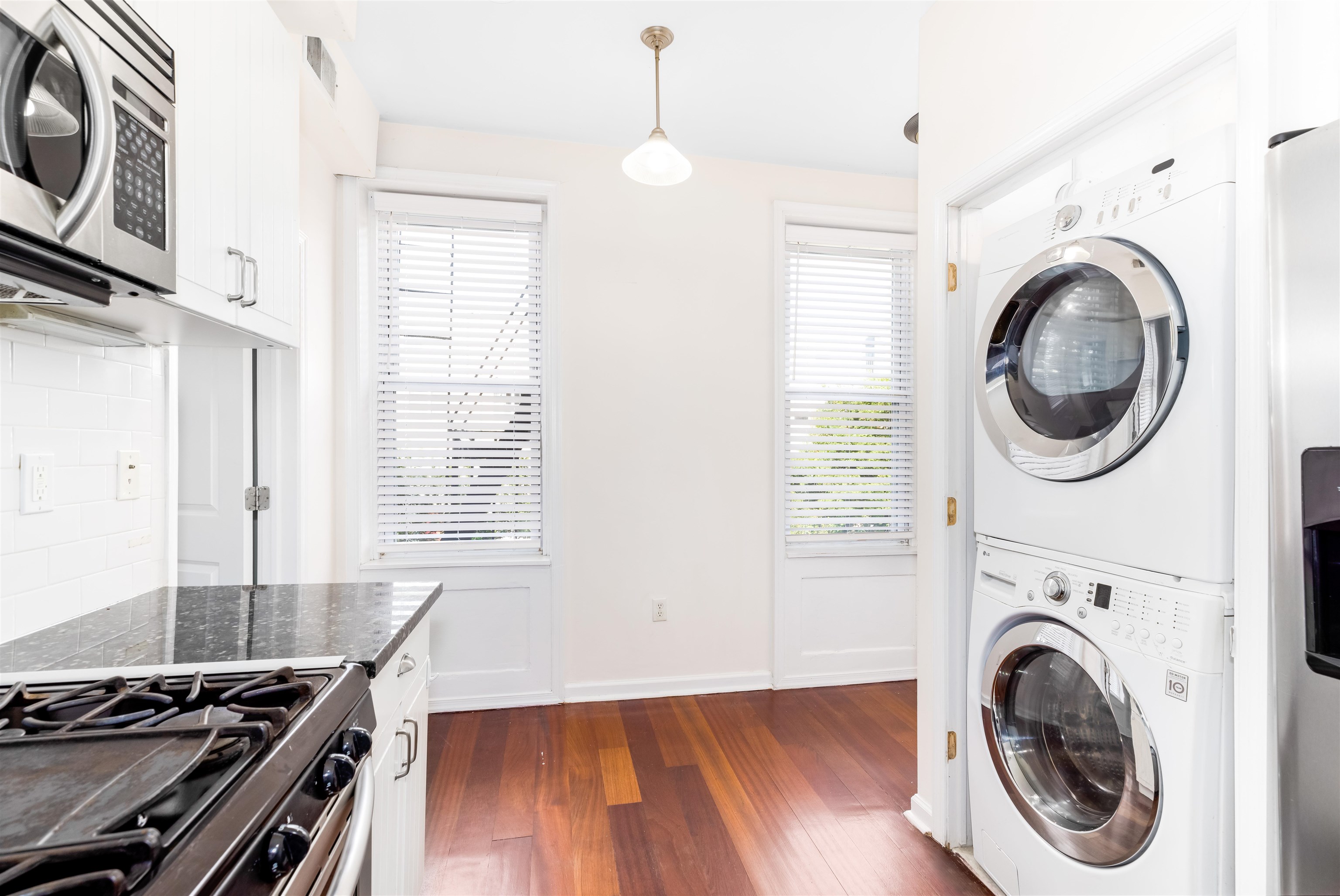 228 Jefferson Street, Unit 2 (R) Hoboken, NJ 07030 - Photo 6 of 15 a view of a kitchen with washer and dryer