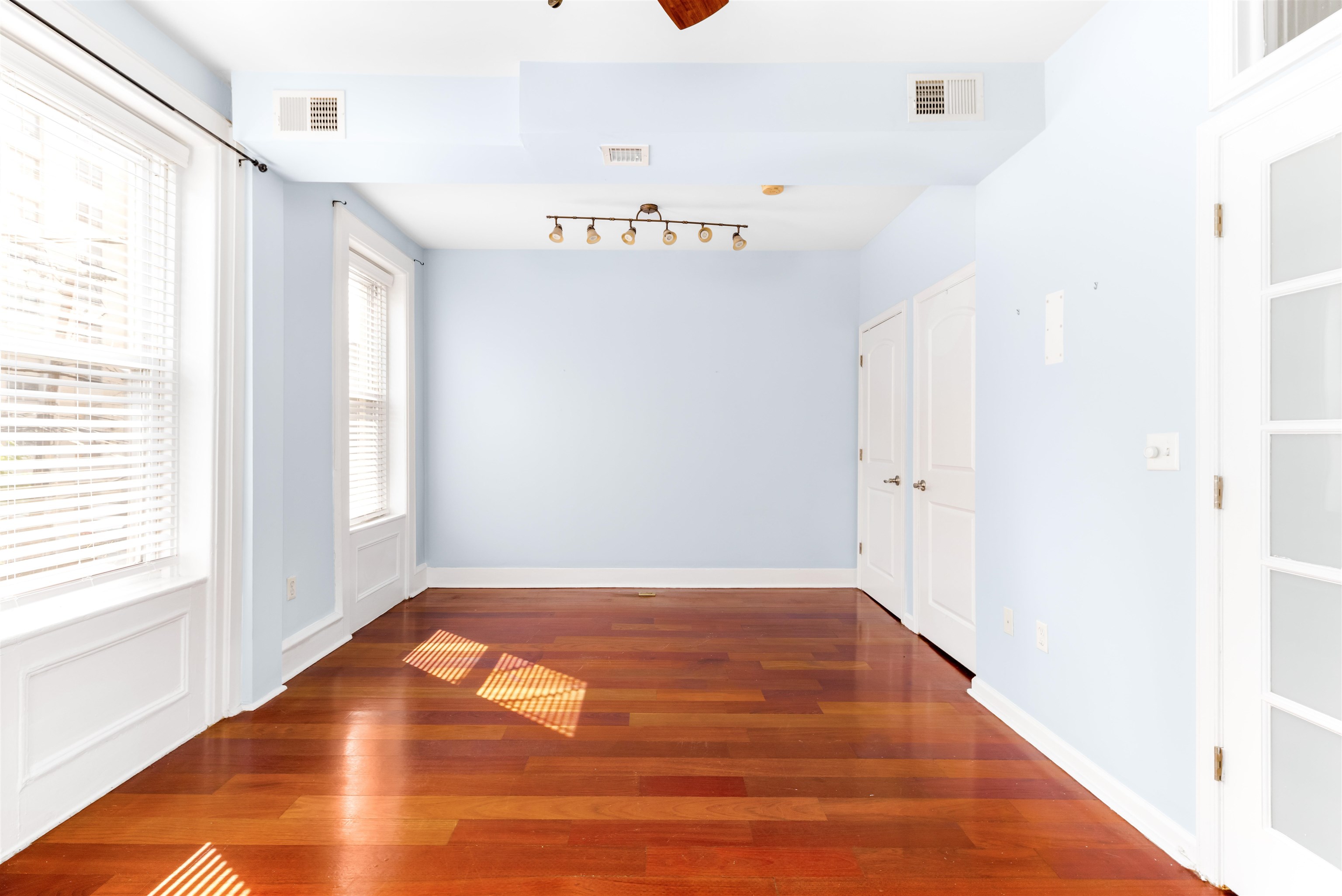 228 Jefferson Street, Unit 2 (R) Hoboken, NJ 07030 - Photo 8 of 15 a view of an empty room with wooden floor and a window