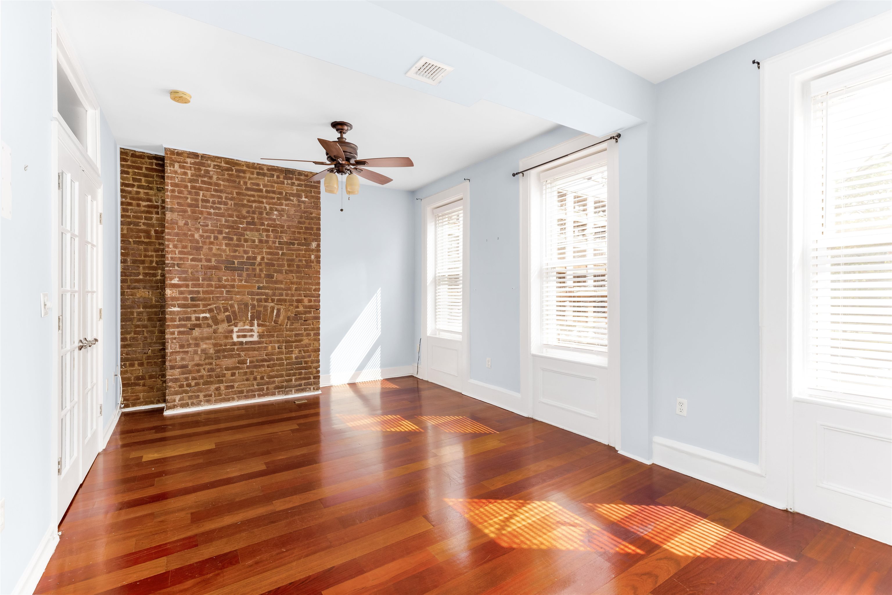 228 Jefferson Street, Unit 2 (R) Hoboken, NJ 07030 - Photo 10 of 15 a view of an empty room with wooden floor and a window