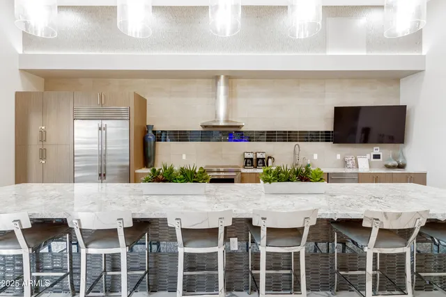 a kitchen with a counter top space and wooden floor