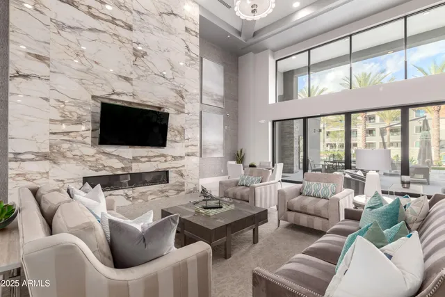 a living room with fireplace furniture and a flat screen tv