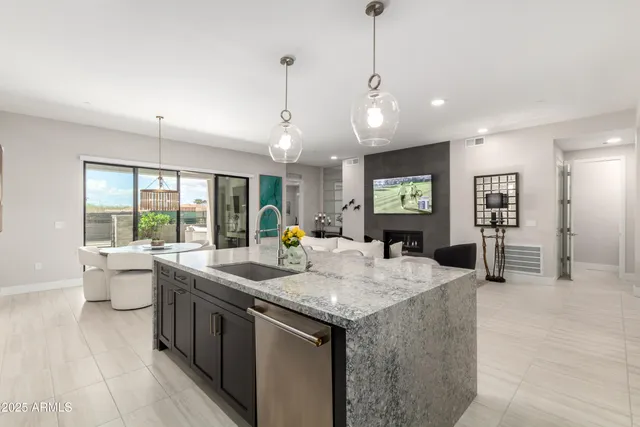 a kitchen with sink and center island