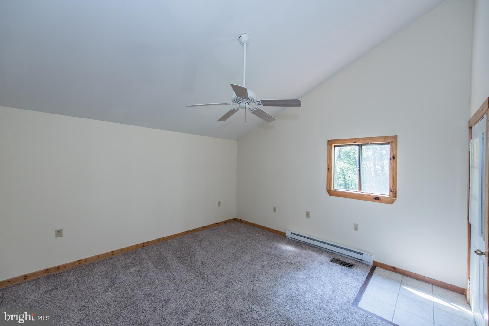 116 Hickory Hollow Road Berkeley Springs, WV 25411 - Photo 16 of 30 a view of a room with window and ceiling fan