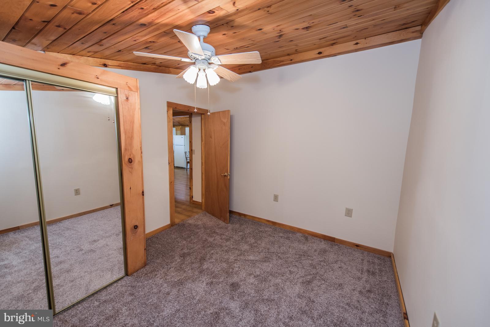 116 Hickory Hollow Road Berkeley Springs, WV 25411 - Photo 20 of 30 an empty room with chandelier fan